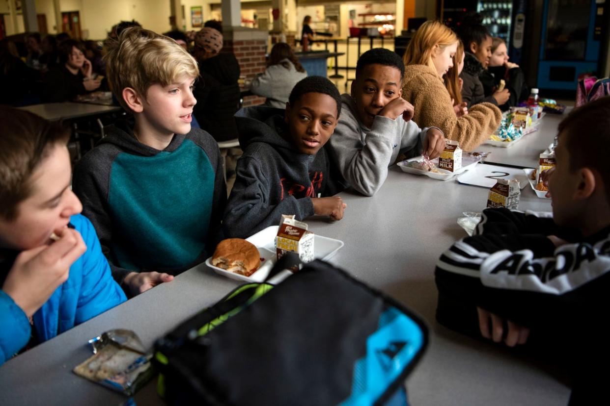 Students Sam Alexandrian, Tayden Neeley, Carmello Hall and Javion Hancock eat lunch together at Marshall Middle School on Monday, Feb. 3, 2020 in Marshall, Mich. Marshall Public Schools is asking voters to consider a $90 million bond proposal this spring.