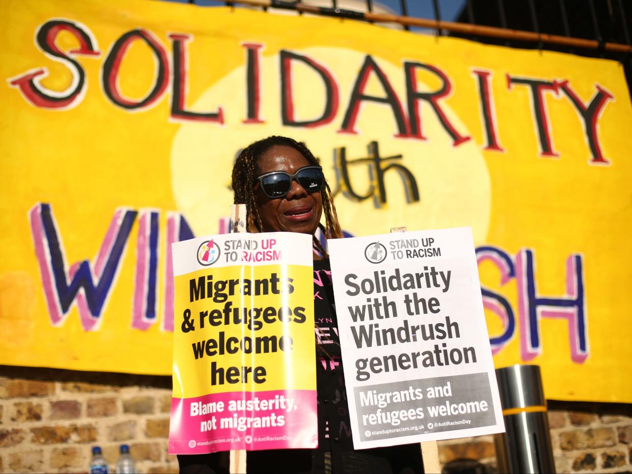 A woman at a protest in Windrush Square, Brixton, in solidarity with Windrush scandal victims (PA)