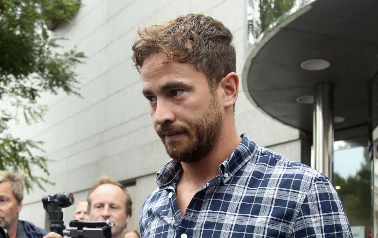 British rugby player Danny Cipriani leaves Jersey Magistrates' Court, Saint Helier, Jersey, one of the Channel Islands, on Thursday Aug. 16, 2018, where he pleaded guilty to charges of common assault and resisting arrest following an incident in a nightclub on the island. (Yui Mok/PA via AP)