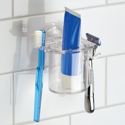 This morning-proof suction cup-backed toothbrush and razor organiser