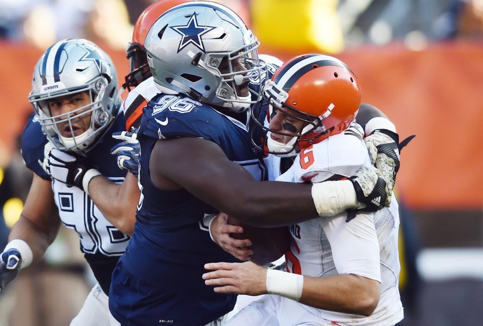 <p>Dallas Cowboys defensive tackle Maliek Collins (96) sacks Cleveland Browns quarterback Cody Kessler (6) during the second half at FirstEnergy Stadium. The Cowboys won 35-10. Mandatory Credit: Ken Blaze-USA TODAY Sports </p>