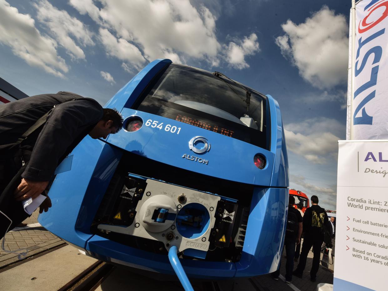 A visitor check out the engine of the Coradia iLint train, a CO2-emission-free regional train