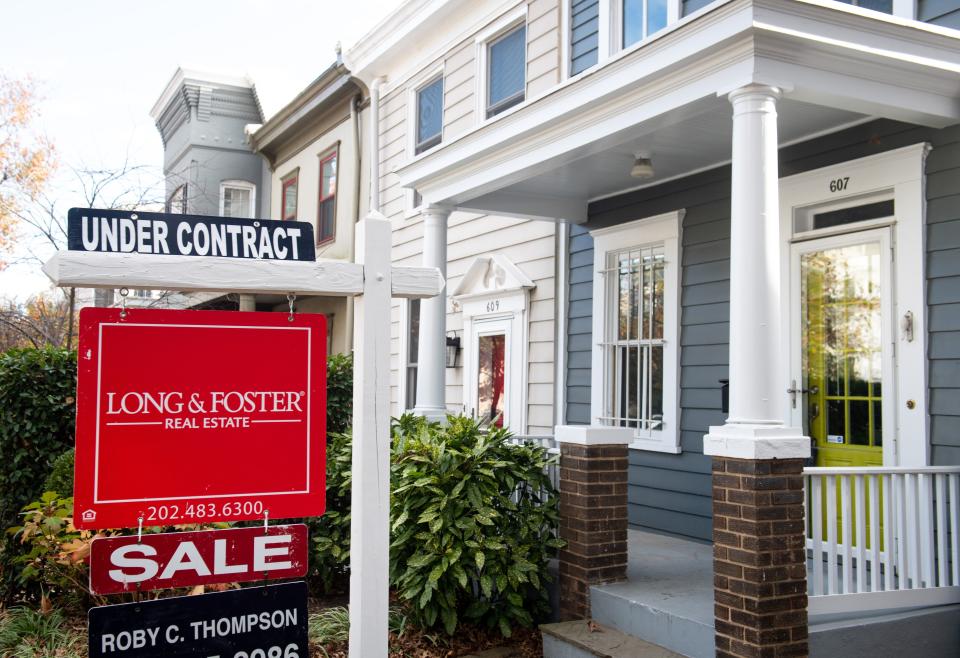 A houseÕs real estate for sale sign shows the home as being Òunder contractÓ in Washington, DC, November 19, 2020. - The US real estate market is booming even as the coronavirus crisis intensifies, and the seemingly insatiable appetite for new and older homes has sent prices soaring -- meaning more and more families with modest incomes are seeing their dreams of owning property shattered. (Photo by SAUL LOEB / AFP) (Photo by SAUL LOEB/AFP via Getty Images)