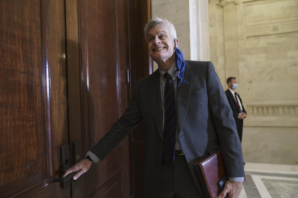 Rep. Bill Cassidy, R-La., arrives for Senate Republicans leadership elections but the door was locked, on Capitol Hill in Washington, Tuesday, Nov. 10, 2020. (AP Photo/J. Scott Applewhite)