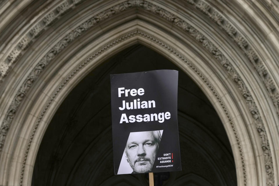 A banner is held up outside the Royal Courts of Justice in London, Tuesday, Feb. 20, 2024. WikiLeaks founder Julian Assange will make his final appeal against his impending extradition to the United States at the court. (AP Photo/Kirsty Wigglesworth)