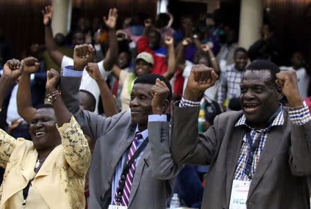 Delegates celebrate after Zimbabwean President Robert Mugabe was dismissed as party leader at an extraordinary meeting of the ruling ZANU-PF's central committee in Harare, Zimbabwe, November 19, 2017. REUTERS/Philimon Bulawayo