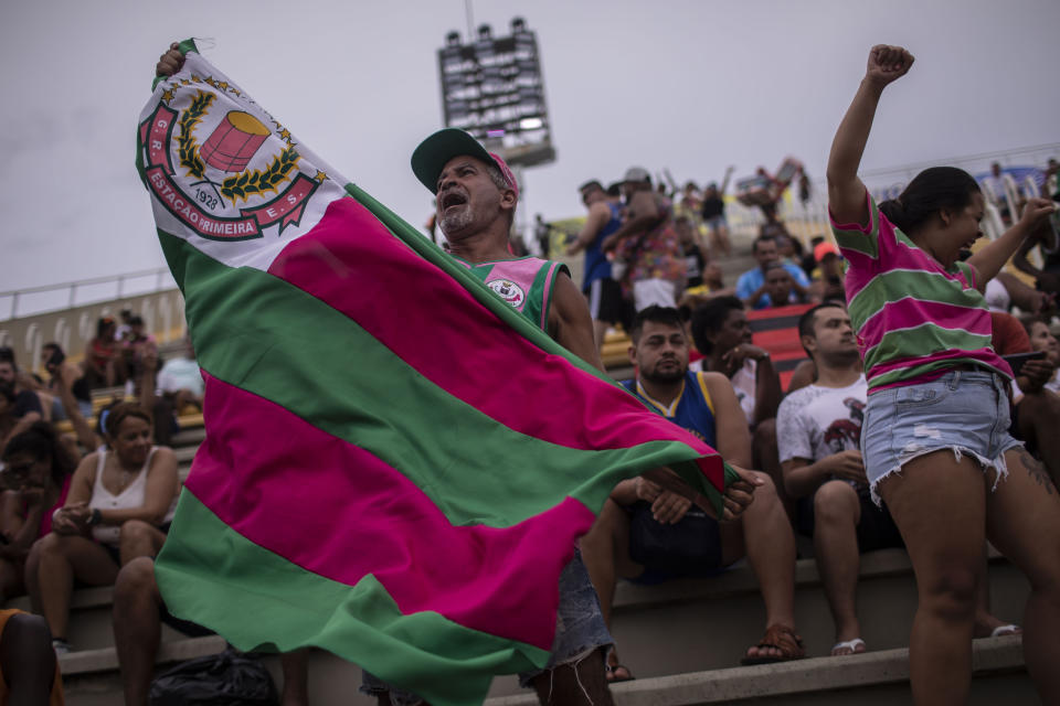 Members of the Mangueira samba school celebrate during the vote count that defines the champion samba school of this year's carnival, at the Sambodromo in Rio de Janeiro, Brazil,Wednesday, Feb. 22, 2023. (AP Photo/Bruna Prado)