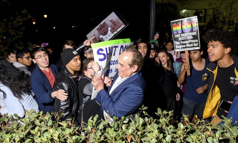 Protesters confront a man leaving a speech by Ann Coulter at the University of California, Berkeley, on 20 November.