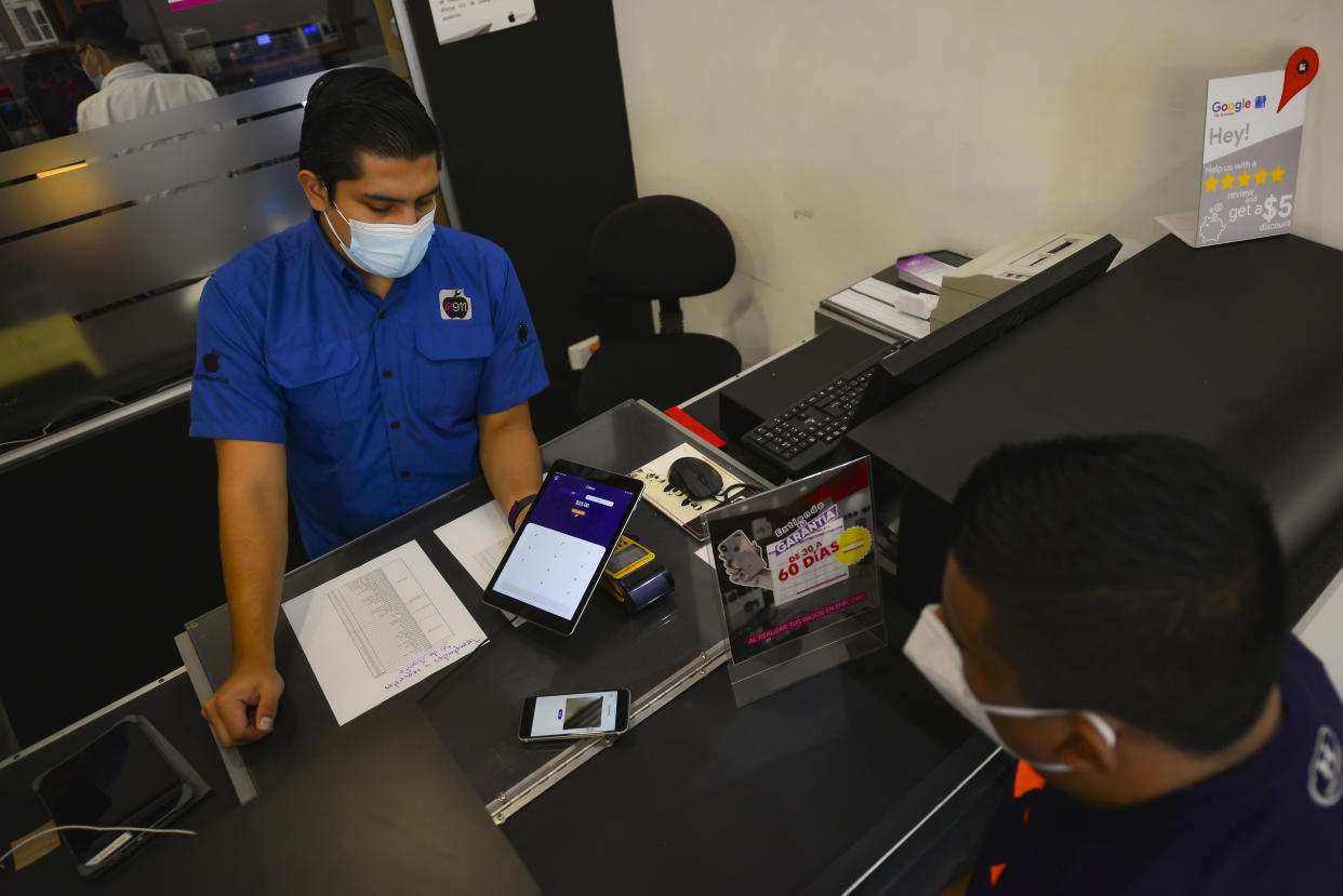 SAN SALVADOR, EL SALVADOR - SEPTEMBER 09: Salvadoran workers, businessmen and merchants begin payment and collection operations in the state Bitcoins wallet 