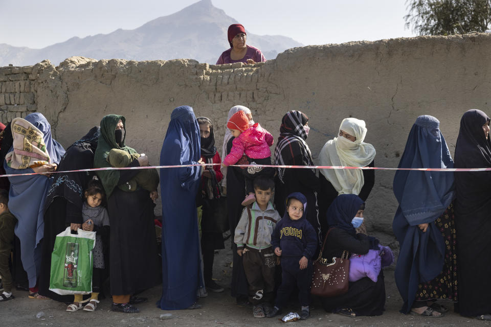 Afghans waiting in line.