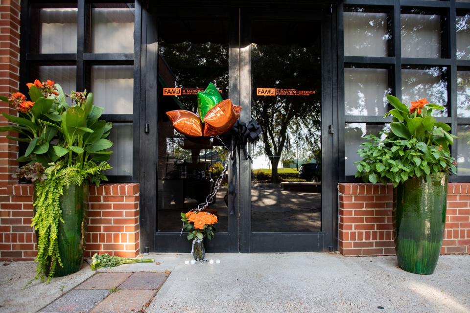 Orange roses, tea light candles, balloons and black bows tied to the door handles of the FAMU Student Union building were placed as a memorial for Andre Green who was found deceased earlier this week.