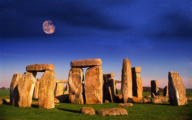 Moonrise over Stonehenge in Wiltshire  - © Patrick Eden / Alamy
