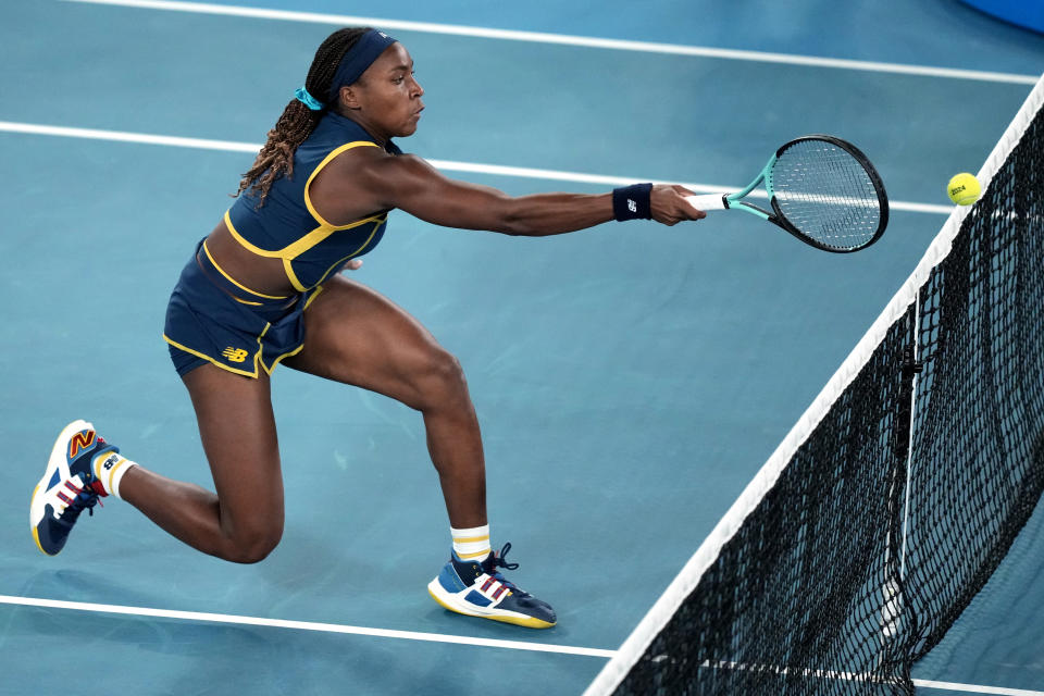 Coco Gauff of the U.S. plays a forehand return to Aryna Sabalenka of Belarus during their semifinal match at the Australian Open tennis championships at Melbourne Park, Melbourne, Australia, Thursday, Jan. 25, 2024. (AP Photo/Alessandra Tarantino)