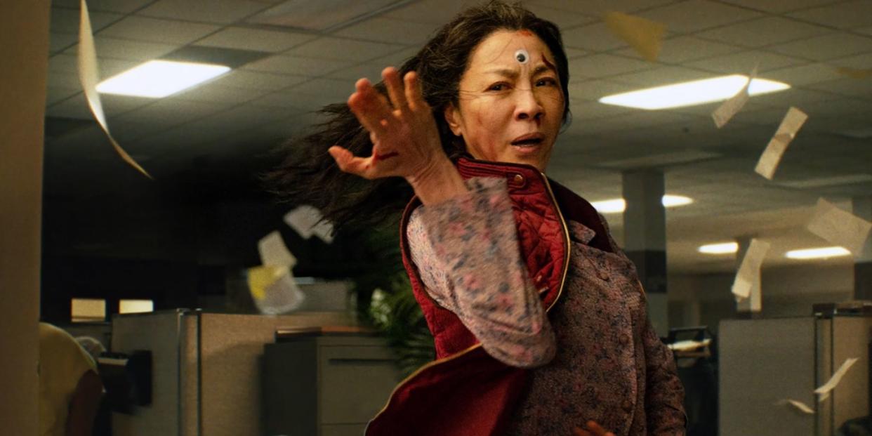 michelle yeoh goes into fighting stance in an irs office in the film everything everywhere all at once