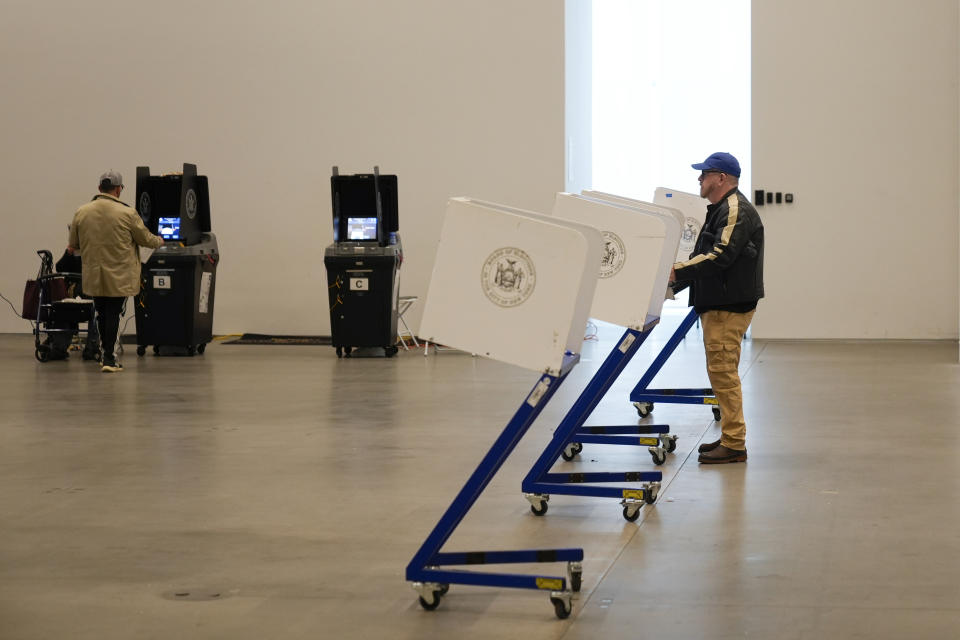 Voters fill out their ballots at a polling site in Manhattan, New York, Tuesday, April 2, 2024. New York is among four states casting their ballots in the 2024 presidential primary; both President Joe Biden and former President Donald Trump already have enough delegates to secure their parties' nominations. (AP Photo/Seth Wenig)