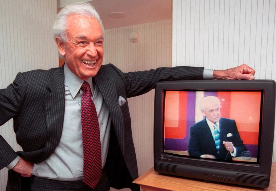 Legendary game show host Bob Barker, 73, leans on his hotel room television showing his image, during an interview Monday, Oct. 23, 2000 in Cambridge, Mass.