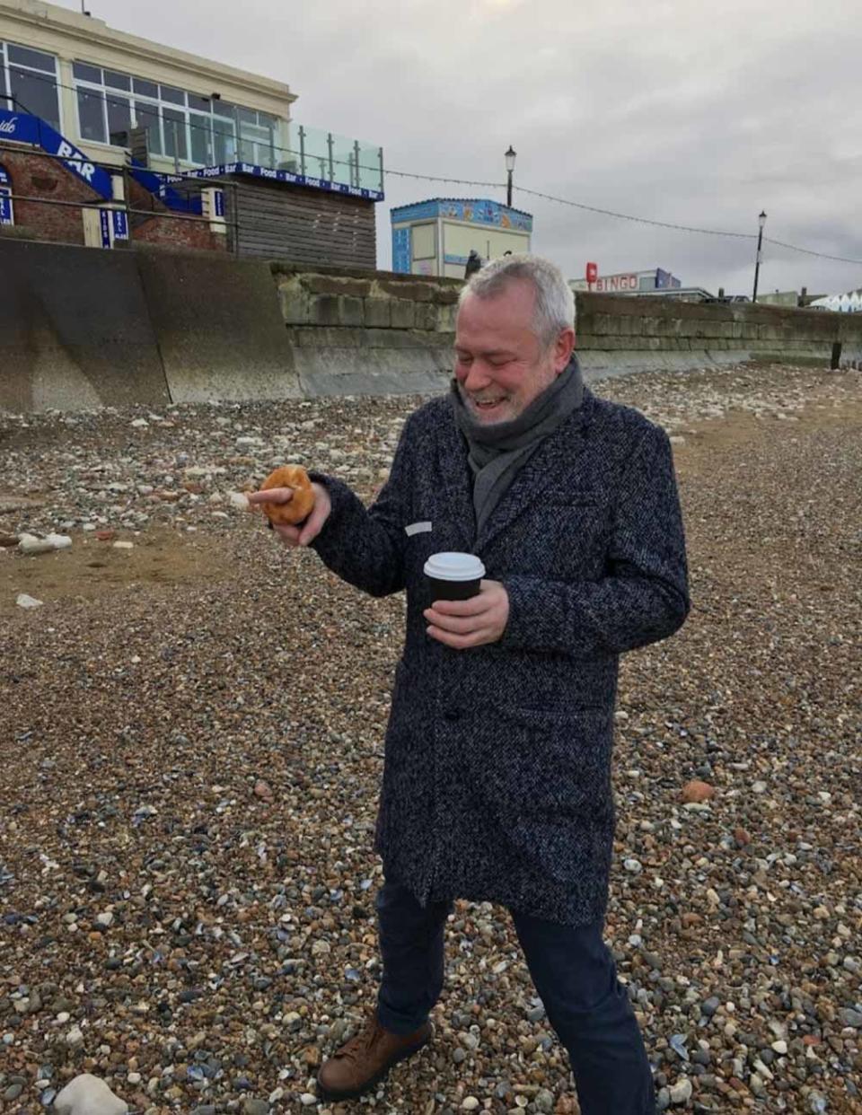 John proposed to Richard with a cinnamon ring doughnut on the beach. (Collect/PA Real Life)