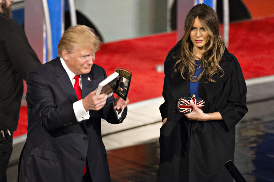 Malania Trump, right, wife of Donald Trump, president and chief executive of Trump Organization Inc. and 2016 Republican presidential candidate, left, stands on stage next to her husband at the conclusion of a presidential candidate debate in Milwaukee, Wisconsin, U.S., on Tuesday, Nov. 10, 2015. The fourth Republican debate, hosted by Fox Business Network and the Wall Street Journal, focuses on the economy with eight presidential candidates included in the main event and four in the undercard version. Photographer: Daniel Acker/Bloomberg via Getty Images 