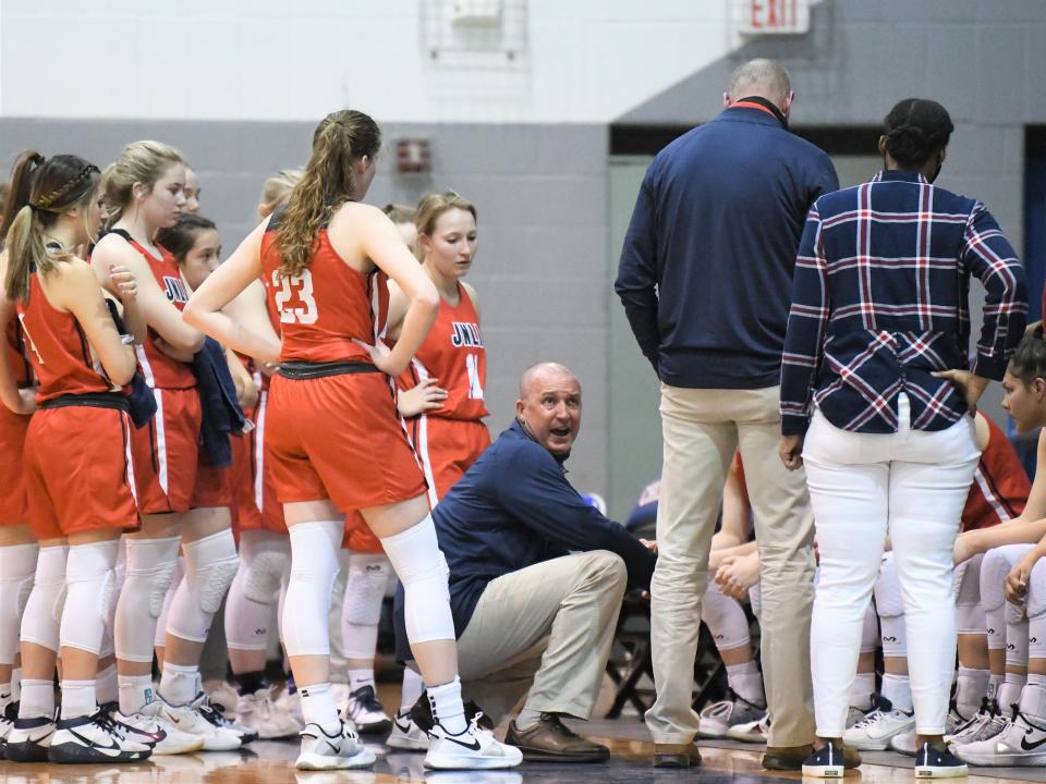 Jim Ned coach Hunter Cooley, center, talks to his team during a timeout against Shallowater in a Region I-3A semifinal Feb. 26, 2021, at the Bobcat Den in Childress.