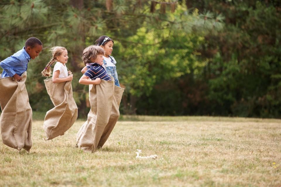 <p>All you need to set up this party game is some wide open space and a few <a href="https://www.amazon.com/Carnival-Outdoor-Activity-Supplies-Decorations/dp/B07N8LVLNW/ref=sr_1_2?tag=syn-yahoo-20&ascsubtag=%5Bartid%7C10070.g.32818345%5Bsrc%7Cyahoo-us" rel="nofollow noopener" target="_blank" data-ylk="slk:burlap sacks;elm:context_link;itc:0;sec:content-canvas" class="link ">burlap sacks</a>. You can also use older pillowcases, if you're setting up a race for younger kids. </p>