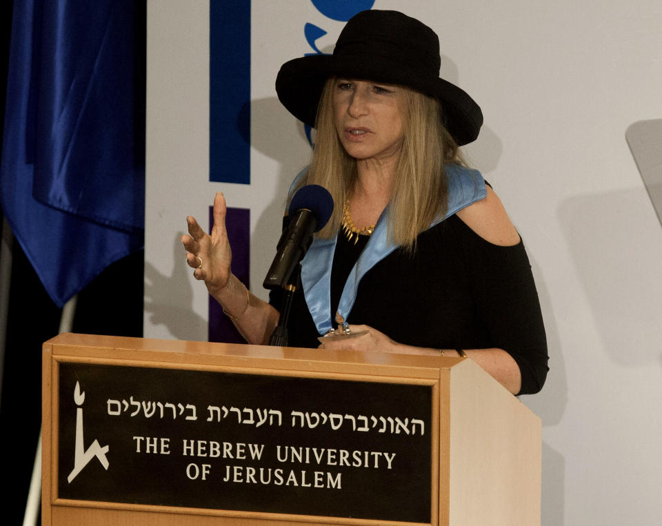 Entertainment star Barbra Streisand speaks during a ceremony at the Hebrew University in Jerusalem after she received an honorary doctorate in Jerusalem, Monday, June 17, 2013. Streisand waded into one of Israel’s touchiest issues Monday on the first major stop of her tour of the country Jewish religious practices that separate men and women. (AP Photo/Dan Balilty)