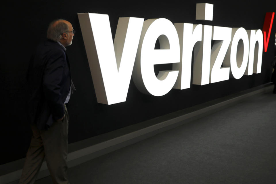 A man stands next to the logo of Verizon at the Mobile World Congress in Barcelona, Spain, February 26, 2019. REUTERS/Sergio Perez