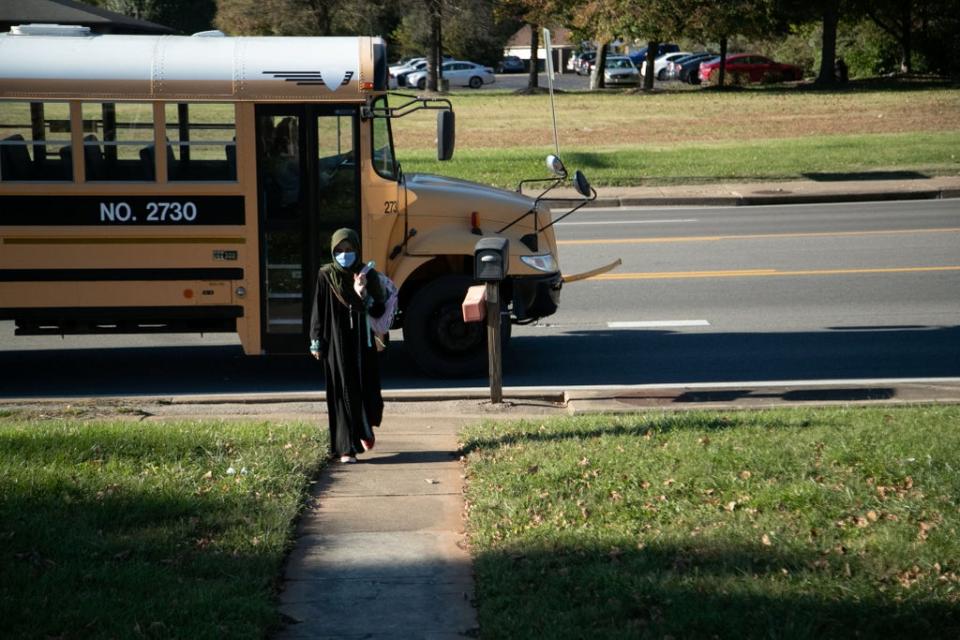 Zuleikha Zardan walks from the school bus, near her home in Bowling Green (Reuters)
