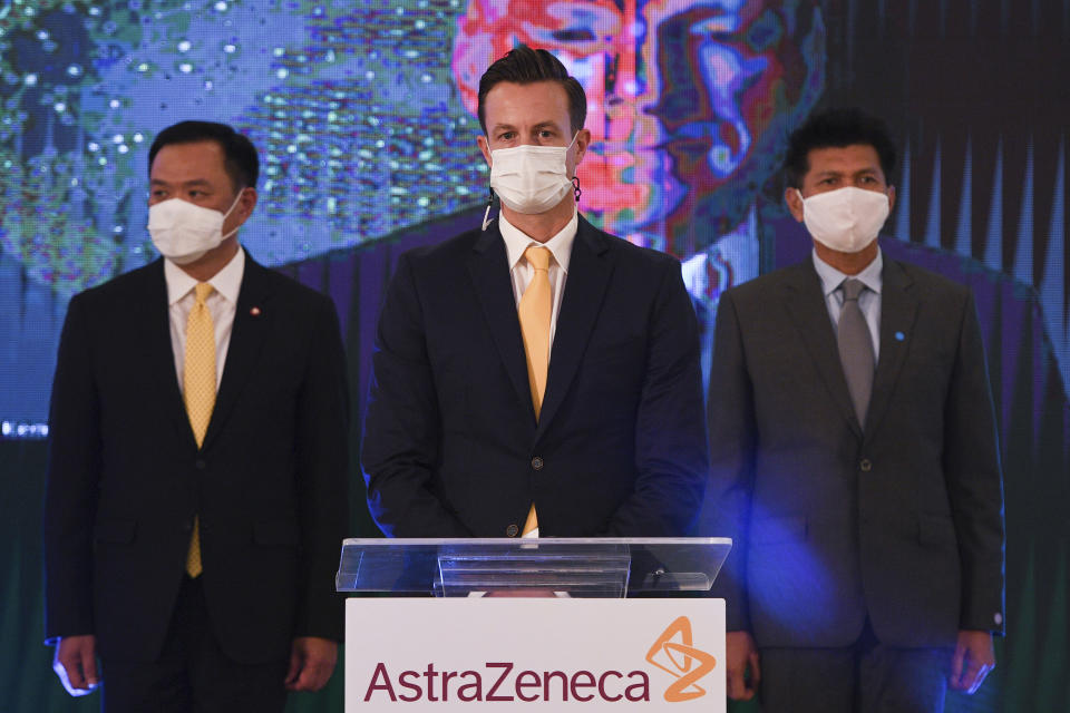 James Teague, center, president of AstraZeneca's in Thailand attends a signing ceremony at Government House in Bangkok, Thailand Friday, Nov. 27, 2020. Thailand on Friday signed a deal to procure 26 million doses of the trial coronavirus vaccine developed by pharmaceutical firm AstraZeneca in collaboration with Oxford University. (Chalinee Thirasupa/Pool Photo via AP)