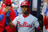Philadelphia Phillies Jean Segura reacts after scoring in the second inning of a baseball game against the Atlanta Braves, Tuesday, May 24, 2022, in Atlanta. (AP Photo/Todd Kirkland)