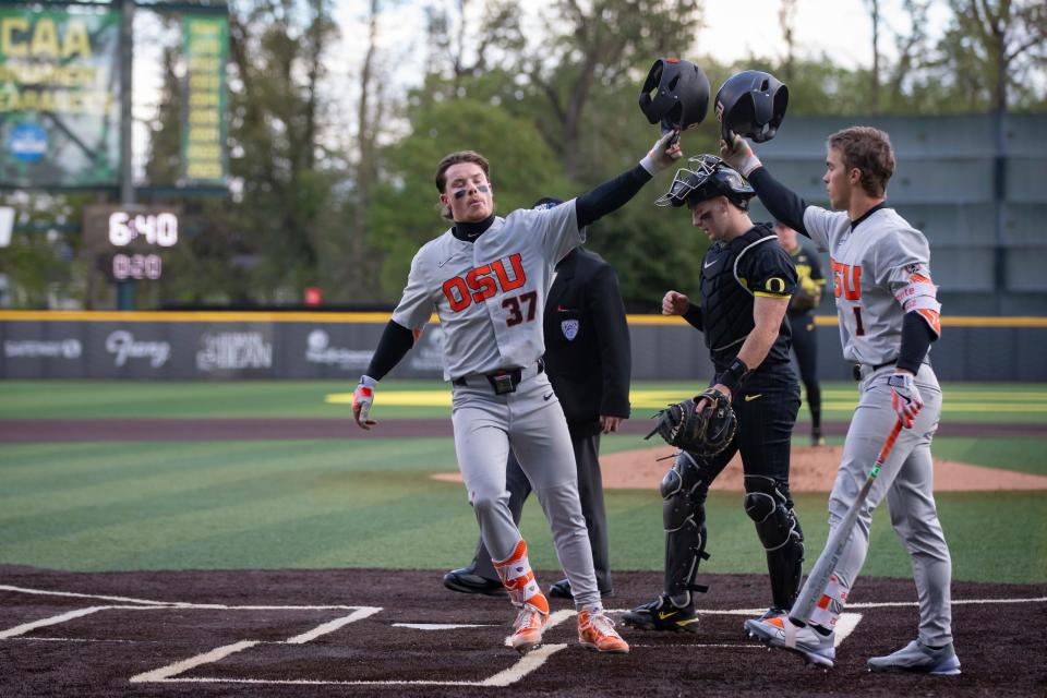 Oregon State infielder Travis Bazzana celebrates with Oregon State outfielder Gavin Turley after Bazzana hit a home run as the Oregon Ducks host the Oregon State Beavers Tuesday, April 30, 2024, at PK Park in Eugene, Ore.