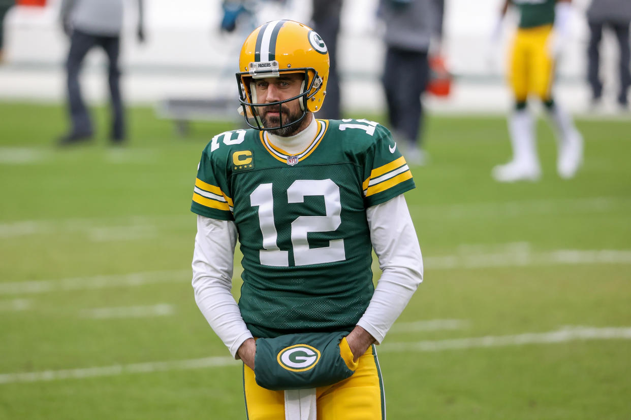 GREEN BAY, WISCONSIN - JANUARY 24: Aaron Rodgers #12 of the Green Bay Packers warms up before the NFC Championship game against the Tampa Bay Buccaneers at Lambeau Field on January 24, 2021 in Green Bay, Wisconsin. (Photo by Dylan Buell/Getty Images)