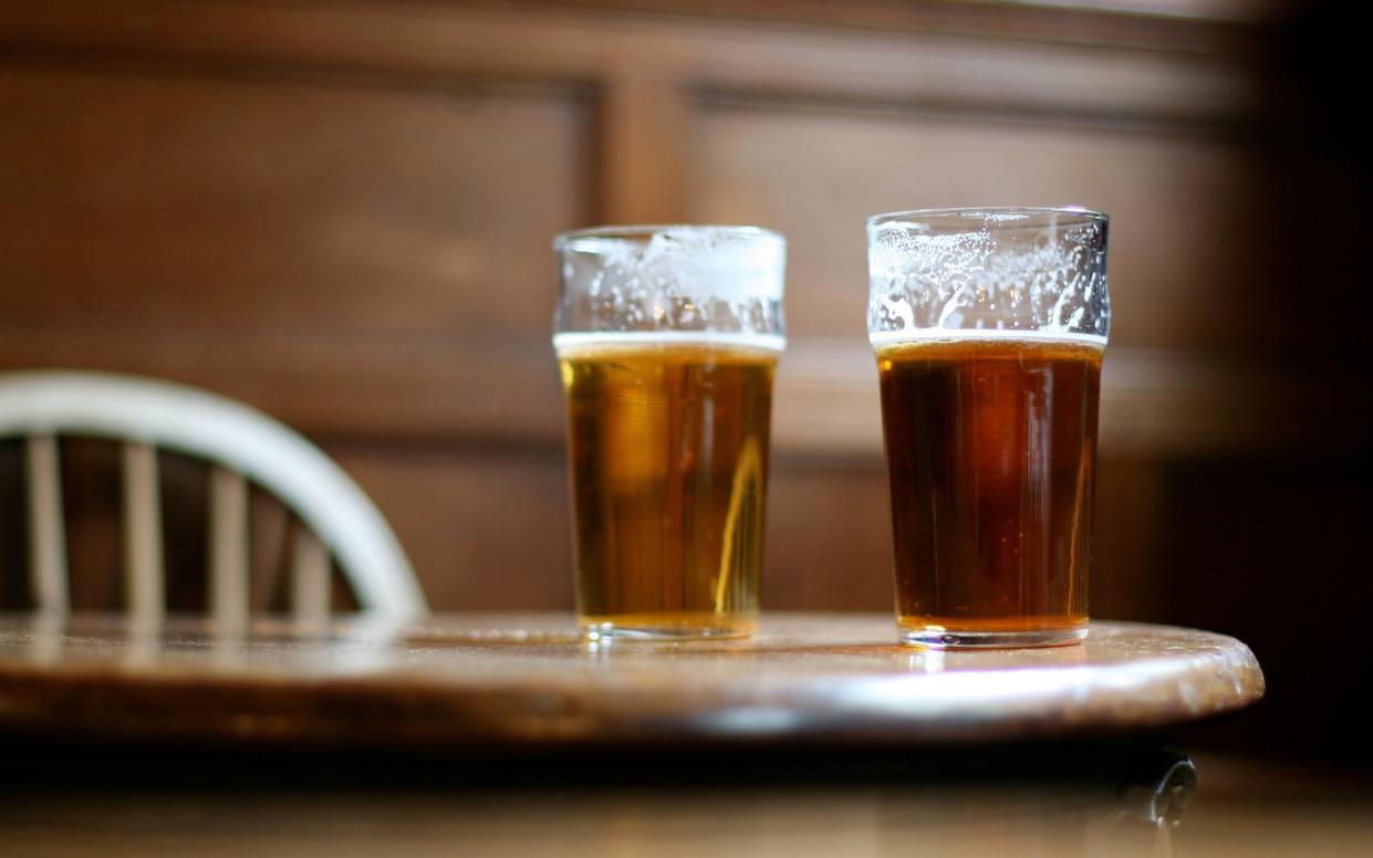 Two pints of beer on table