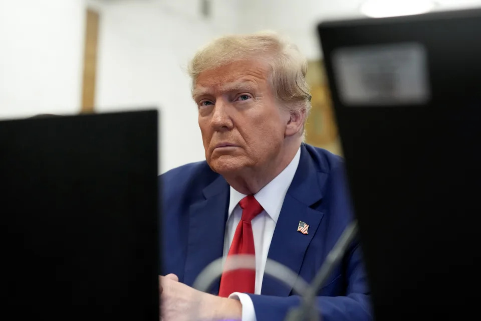 FILE - Former President Donald Trump sits in the courtroom before the start of closing arguments in his civil business fraud trial at New York Supreme Court, Jan. 11, 2024, in New York. Records show over the past two years, Axos Bank and its largest individual shareholder Don Hankey, have extended more than $500 million in financing that has benefited Trump. Ethics experts say they could also grant Hankey and Axos Bank outsize sway in a future Trump administration. (AP Photo/Seth Wenig, Pool, File)