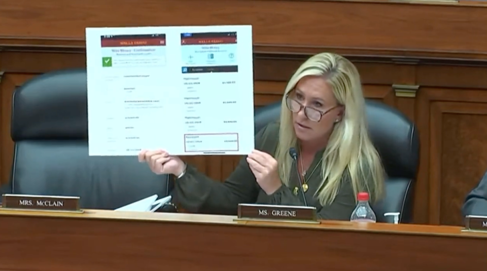 Marjorie Taylor Greene holds up picture boards related to Hunter Biden, some of which include naked photos (Screen grab)