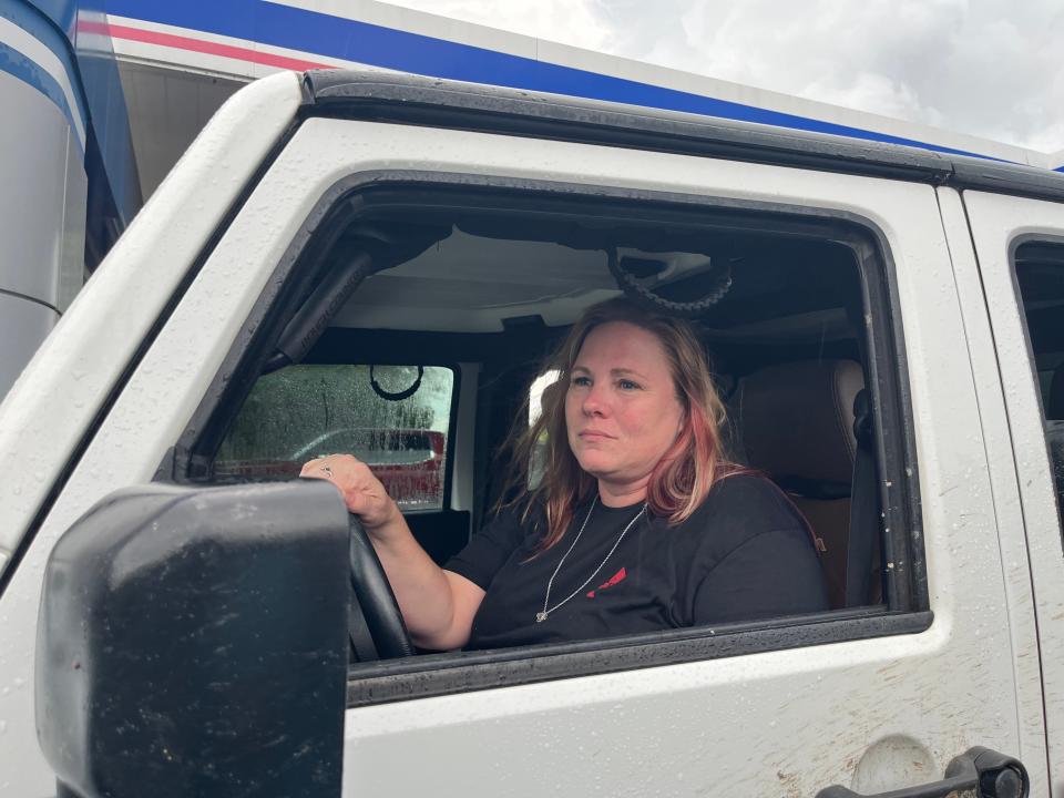 Stephanie Walker sits in her Jeep Wrangler at a Cross City, Fl. gas station on Tuesday evening, August 29, 2023, as Hurricane Idalia approaches. She's staying in a camper down the road with her three dogs and worries about her house in Steinhatchee.