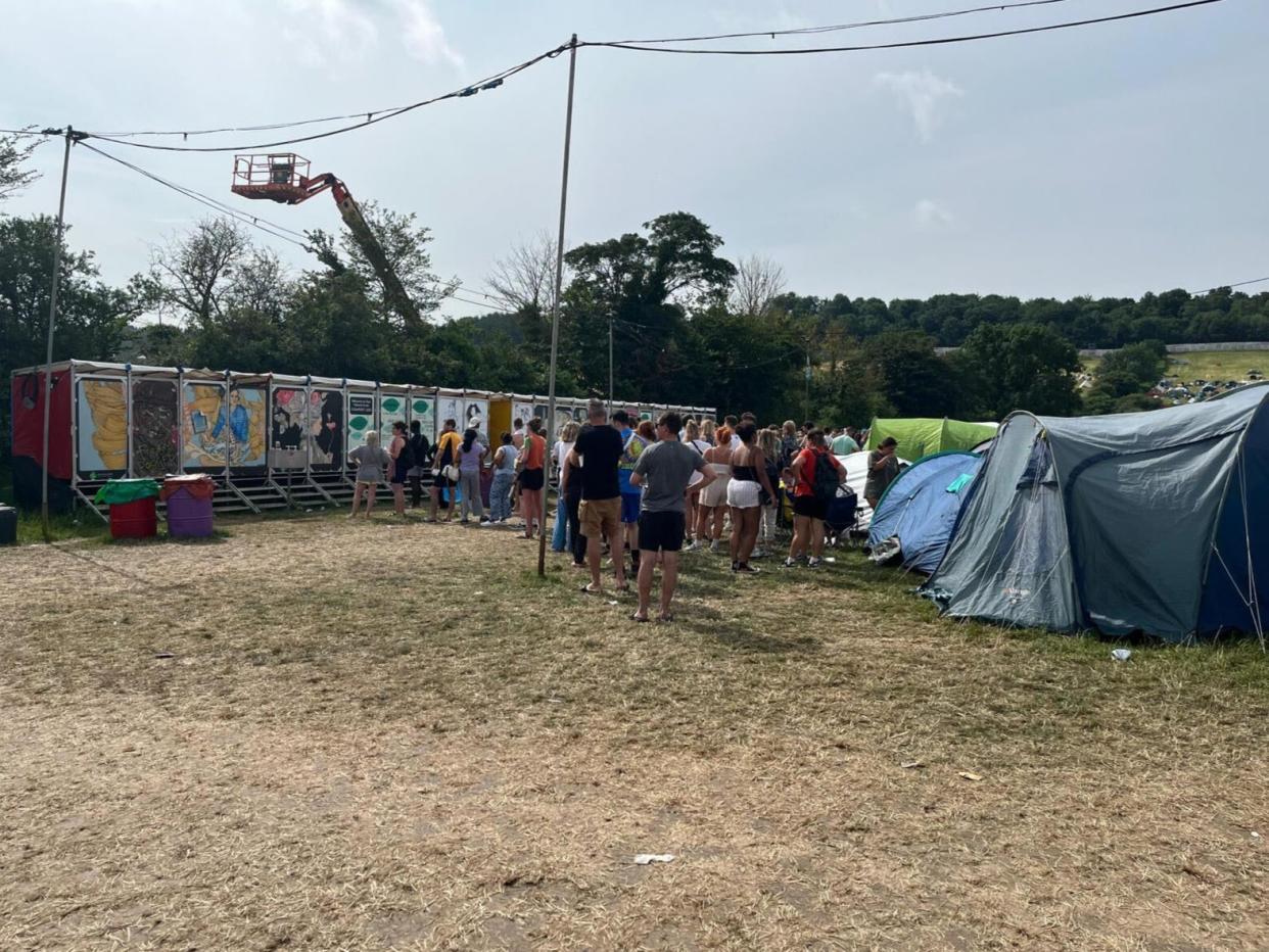 People queuing for the toilets at Glastonbury Festival, day 3 (Adam White)