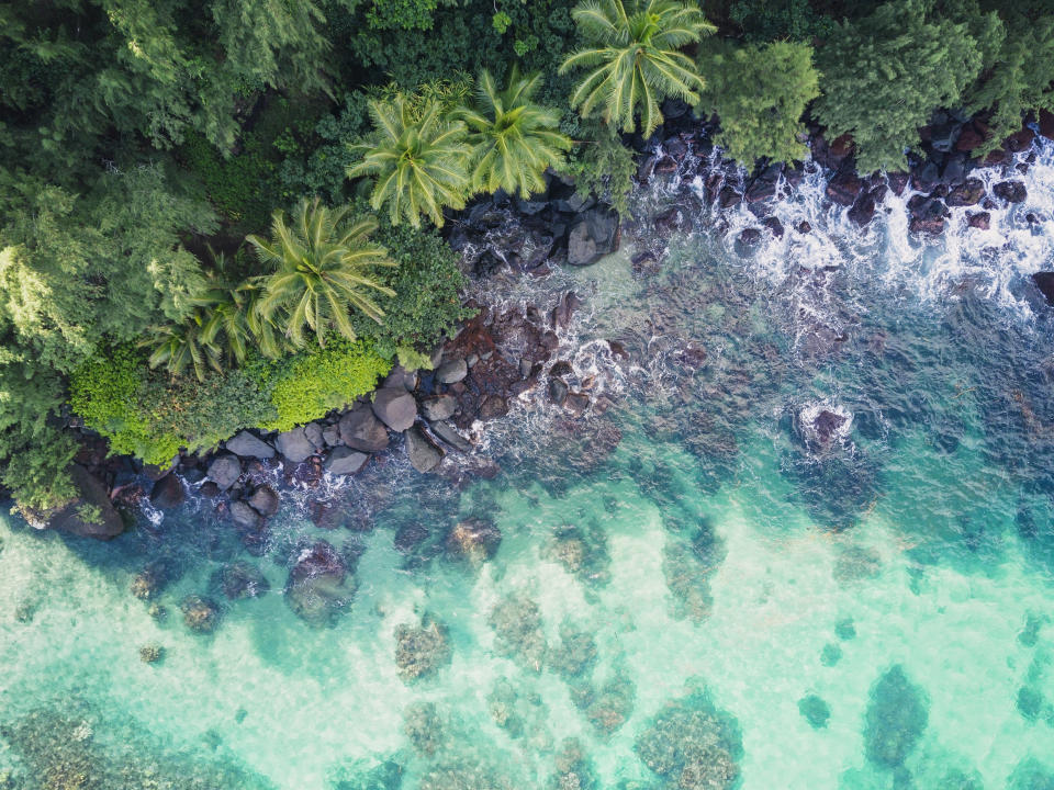 Clear ocean water with rocky seashore