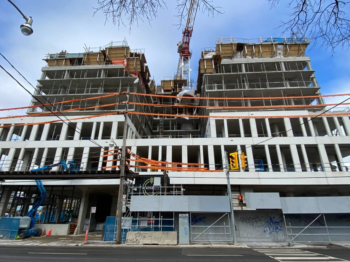 A construction site at Dupont and Bathurst streets in Toronto. The province says it needs more workers in skilled trades to meet housing demands over the next decade. (Patrick Swadden/CBC - image credit)