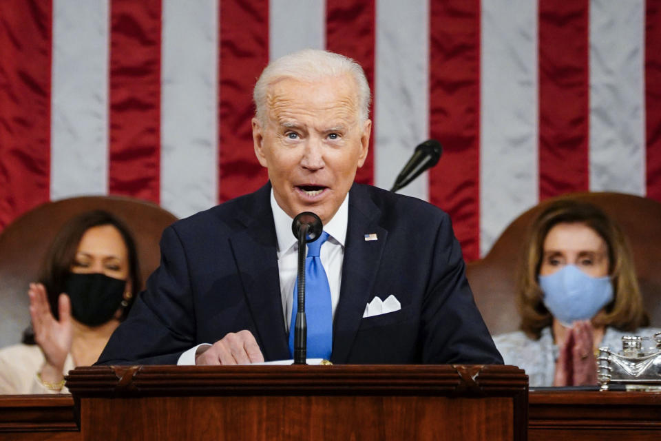 President Joe Biden addresses a joint session of Congress, Wednesday, April 28, 2021, in the House Chamber at the U.S. Capitol in Washington, as Vice President Kamala Harris, left, and House Speaker Nancy Pelosi of Calif., applaud. (Melina Mara/The Washington Post via AP, Pool)