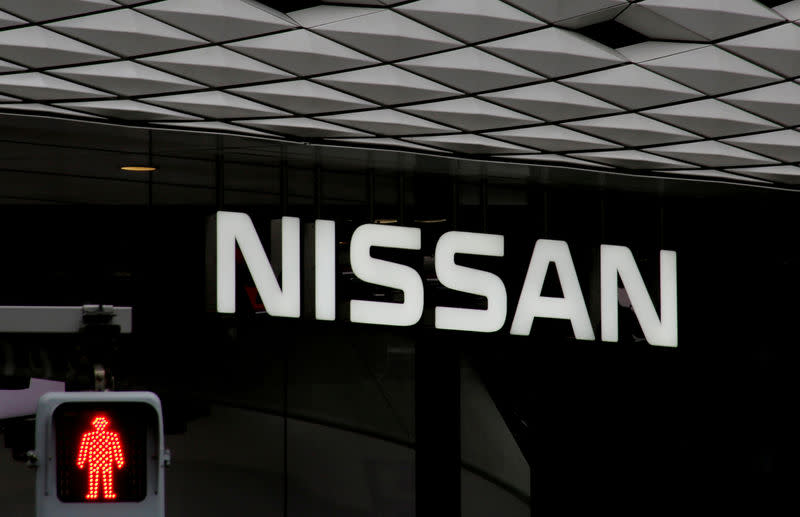 The logo of Nissan Motor Co. is seen at its show room behind a traffic sign in Tokyo, Japan, February 12, 2019. REUTERS/Kim Kyung-hoon/Files