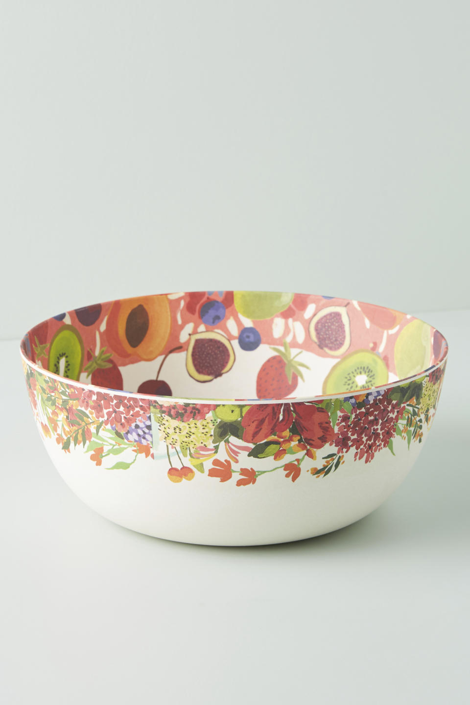 At Anthropologie, pretty painterly renditions of papayas and lemons are printed on a serveware collection made of bamboo and melamine, bringing a tropical touch to al fresco dining. (Anthropology via AP)