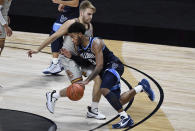 Villanova's Justin Moore works around Boston College's Rich Kelly during the second half of an NCAA college basketball game Wednesday, Nov. 25, 2020, in Uncasville, Conn. (AP Photo/Jessica Hill)