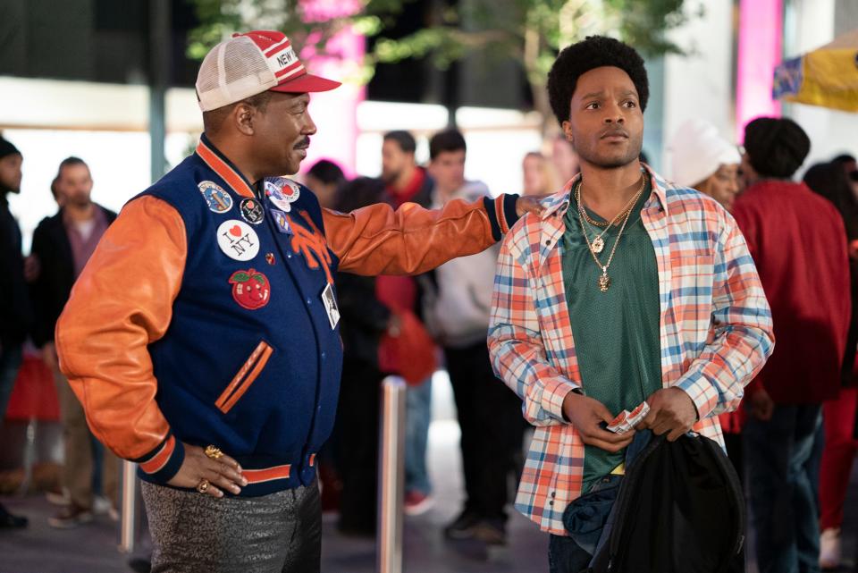The newly crowned King Akeem (Eddie Murphy, left) returns to New York City to meet his son (Jermaine Fowler) in the comedy sequel "Coming 2 America."
