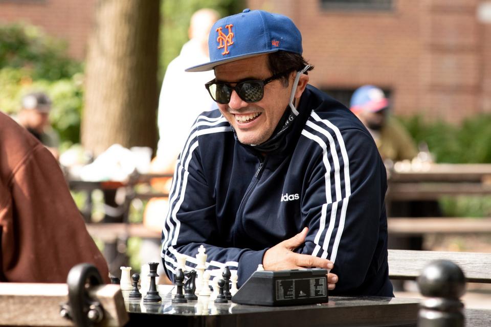 <p>John Leguizamo plays chess in N.Y.C.'s Washington Square Park on Tuesday.</p>