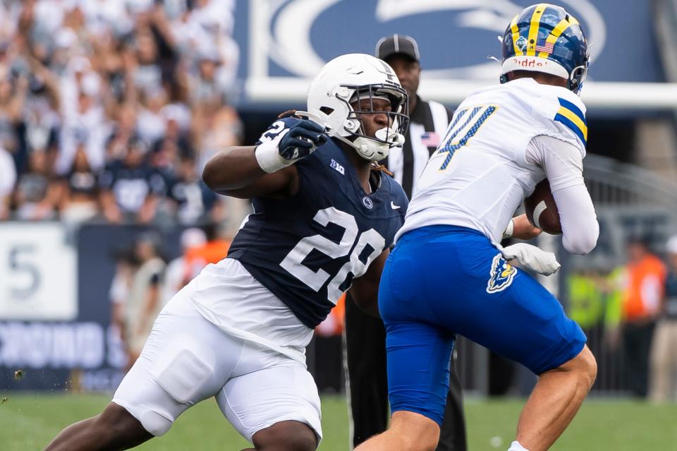 Penn State defensive tackle Zane Durant (28) sacks Delaware quarterback Ryan O'Connor in the second half of a NCAA football game Saturday, Sept. 9, 2023, in State College, Pa.
