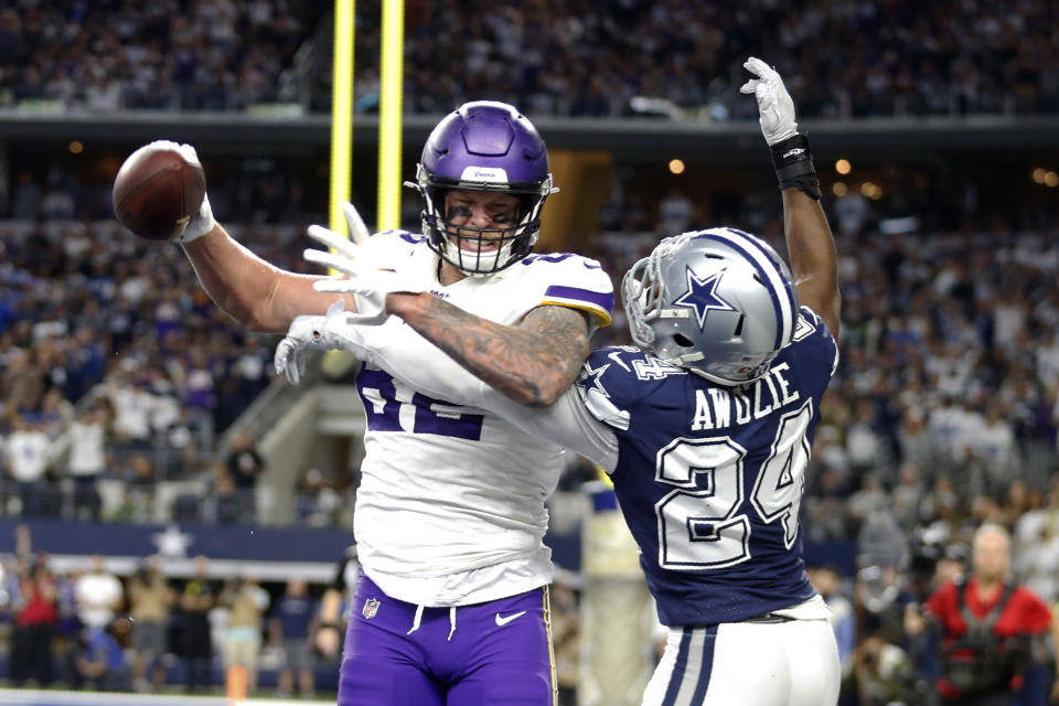 Minnesota Vikings tight end Kyle Rudolph (82) catches a pass for a 2-point conversion in front of Dallas Cowboys cornerback Chidobe Awuzie (24) during the second half of an NFL football game in Arlington, Texas, Sunday, Nov. 10, 2019. (AP Photo/Michael Ainsworth)
