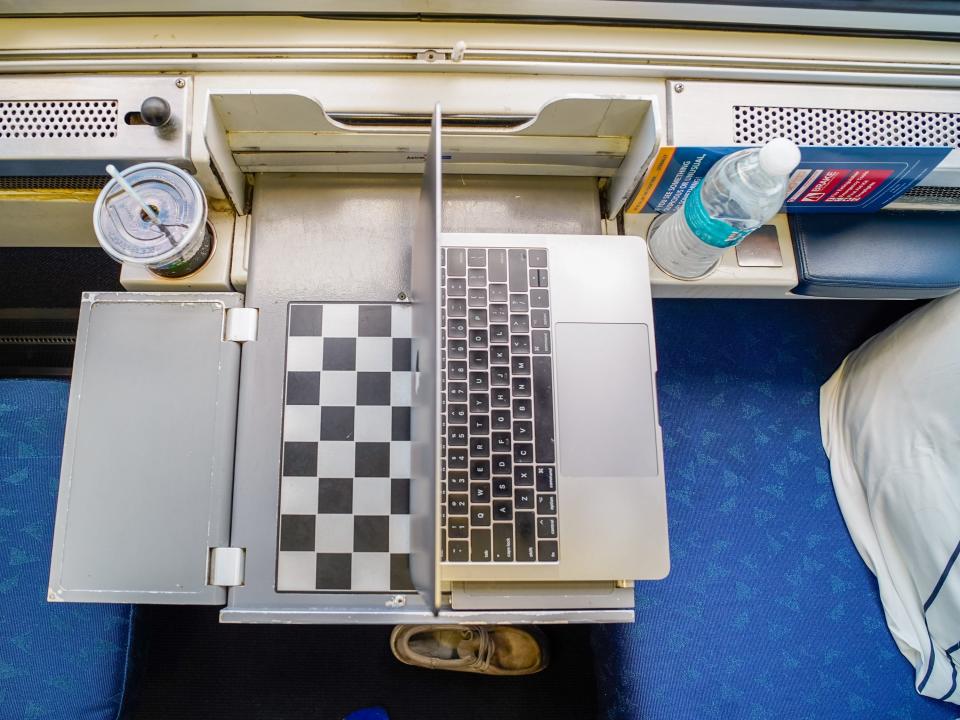 An aerial view of a laptop on the bedroom's pullout table