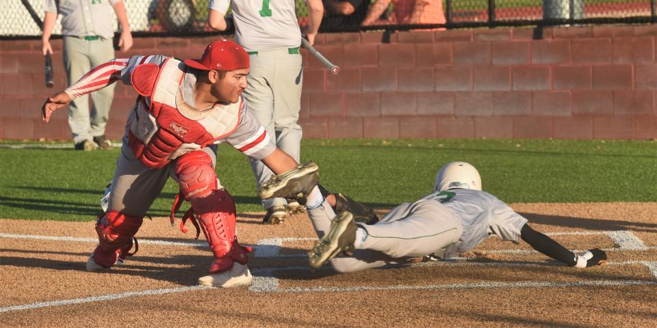 Christoval catcher Sevastian Salinas, left, tags out Hamlin's A.J. Rivera who was trying to steal home on a double steal in the fourth inning.