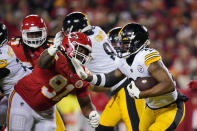 Pittsburgh Steelers running back Najee Harris, right, run from Kansas City Chiefs defensive tackle Derrick Nnadi (91) during the first half of an NFL wild-card playoff football game, Sunday, Jan. 16, 2022, in Kansas City, Mo. (AP Photo/Ed Zurga)