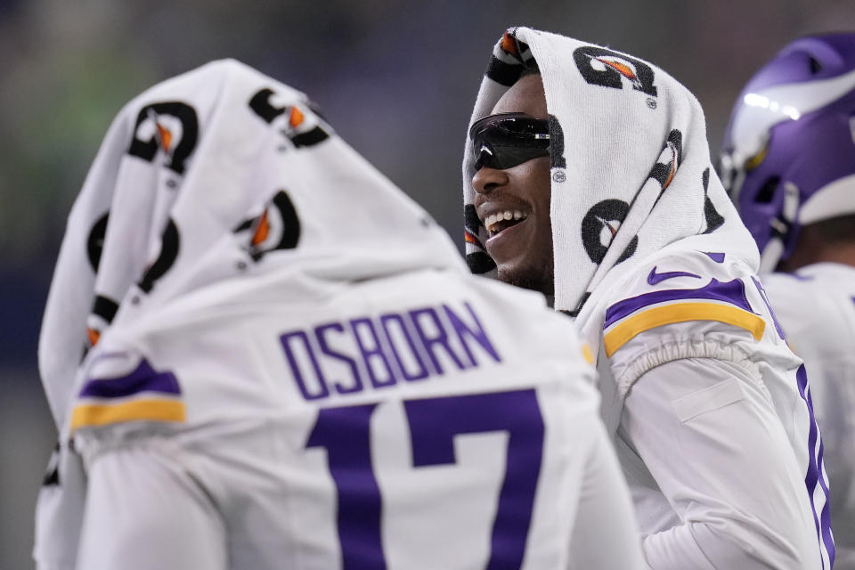 Minnesota Vikings wide receivers K.J. Osborn (17) and Justin Jefferson stand on the sideline during the second half of an NFL preseason football game against the Seattle Seahawks in Seattle, Thursday, Aug. 10, 2023. (AP Photo/Gregory Bull)